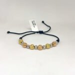 PULSO TEJIDO CON 13 BALINES DE TRES ORO 18K EN HILO NEGRO