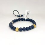 PULSO TEJIDO CON 5 BALINES DE ORO 18K EN HILO NEGRO CON BOLA DE NEOPRENO