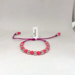 PULSO TEJIDO CON 6 BALINES DE ORO BLANCO 18K CON BOLAS DE NEOPRENO EN ROSADO EN HILO MORADO