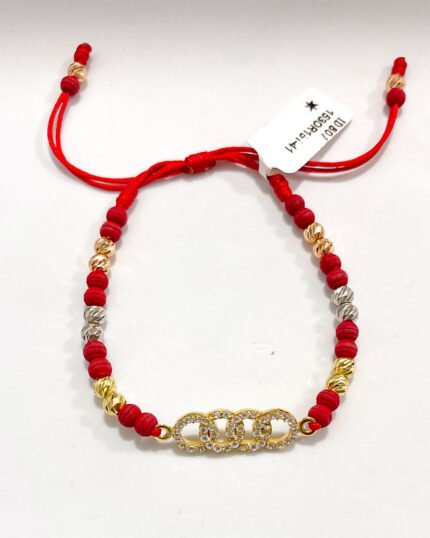 PULSO TEJIDO CON HERRAJE AUDI, 14 BALINES DE ORO 18K BOLAS DE NEOPRENOCON HILO ROJO
