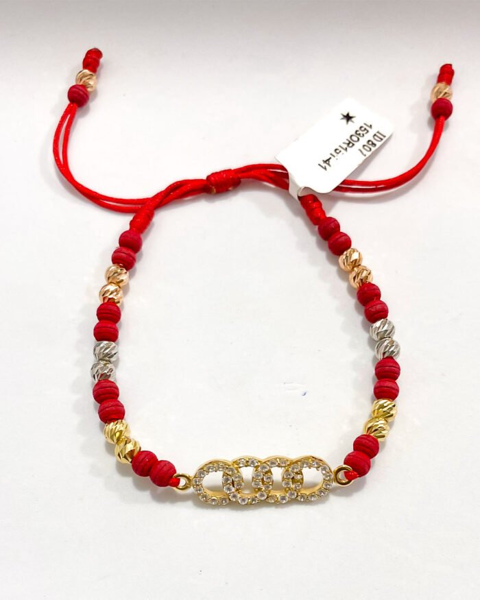 PULSO TEJIDO CON HERRAJE AUDI, 14 BALINES DE ORO 18K BOLAS DE NEOPRENOCON HILO ROJO - Image 1