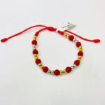 PULSO TEJIDO CON 22 BALINES DE ORO 18K CON BOLAS DE NEOPRENO EN HILO ROJO