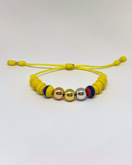 PULSO TEJIDO7 BALINES TRES ORO 18K CON BOLAS DE NEOPRENO EN HILO AMARILLO