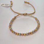 PULSO TEJIDO CON 32 BALINES DE ORO 18K EN HILO BEIGE