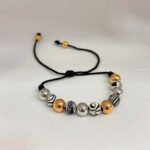 PULSO TEJIDO CON 8 BALINES DE ORO 18K CON BOLAS DE NEOPRENO EN HILO NEGRO