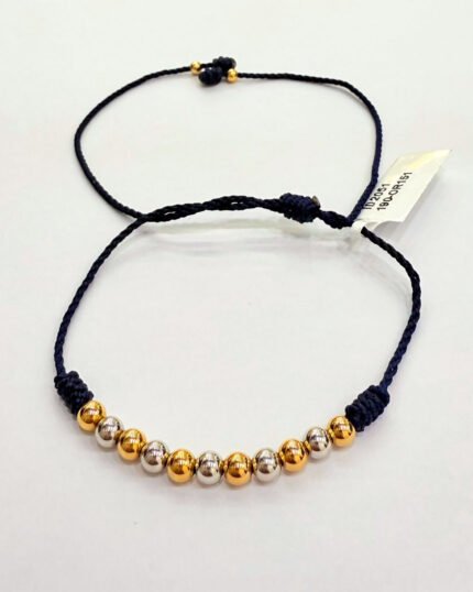 PULSO TEJIDO CON 13 BALINES DE ORO BLANCO Y AMARILLO DE 18K EN HILO NEGRO