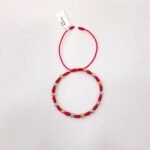 PULSO TEJIDO CON 13 BALINES DE ORO 18K CON CATORCE NUDOS EN HILO ROJO