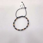 PULSO TEJIDO CON 13 BALINES DE ORO 18K CON CATORCE NUDOS EN HILO NEGRO