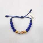 PULSO TEJIDO 4 BALINES DE ORO 18K CON BOLAS DE NEOPRENO EN HILO AZUL MARINO