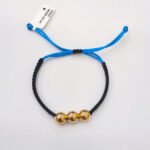 PULSO TEJIDO 3 BALINES DE ORO 18K EN HILO DUAL COLOR