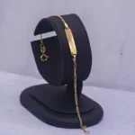 PULSO PLACA TEJIDO TRES POR UNO ORO 18K