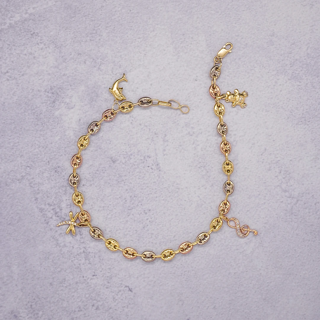 1564273 TOBILLERA GUCCI TRES OROS DIJES ORO 18K - Image 1