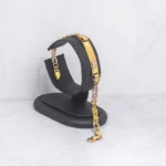 PULSO PLACA TEJIDO OJOS LINCE ORO 18K