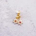 DIJE FLOR PIEDRAS 18K