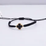 DIJE HERRAJE VAN CLEEF CON PIEDRA BLANCA 18 K