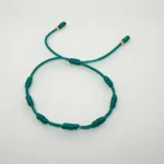 PULSO TEJIDO CON 7 NUDOS EN COLOR VERDE CON 2 BALINES DE ORO 18K
