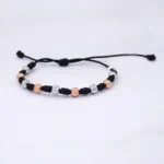 PULSO TEJIDO CON 9 BALINES ORO 18K