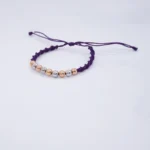 PULSO TEJIDO CON 9 BALINES ORO 18K