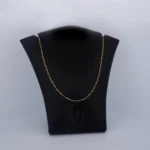 CADENA DE TEJIDO TRES POR UNO FINA EN ORO 18K